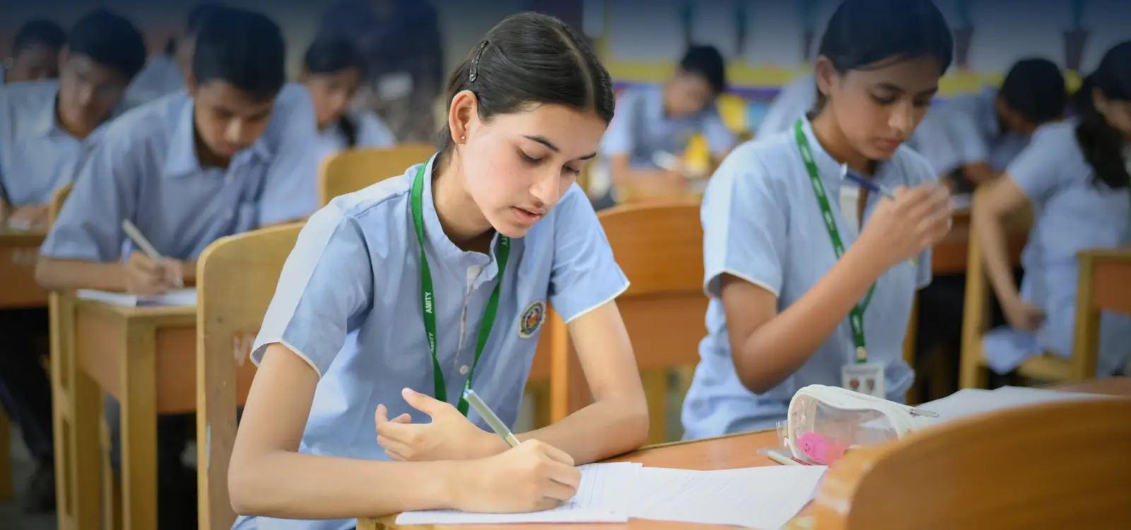 Amity International School Viraj Khand students giving exam in classroom